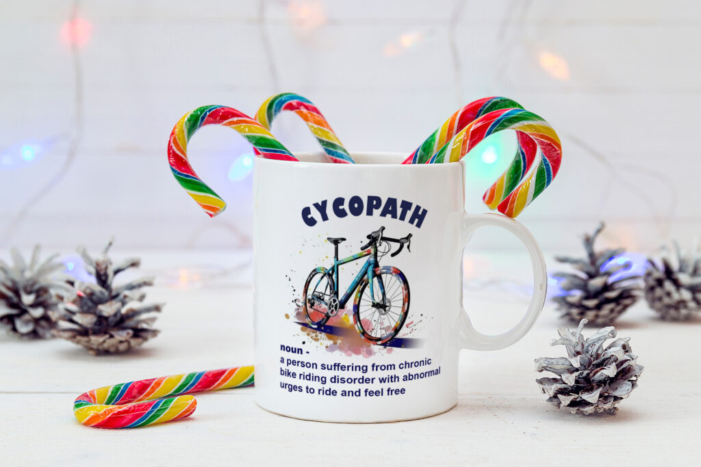 White coffee mug with Christmas Candy Canes and cones. Space for