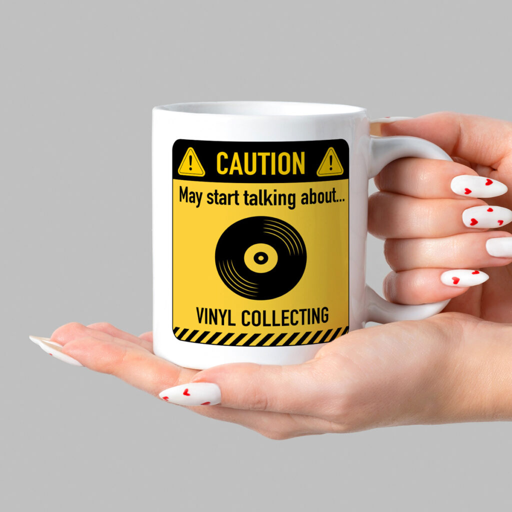 White Mug with Vinyl Collecting Caution Sign Design